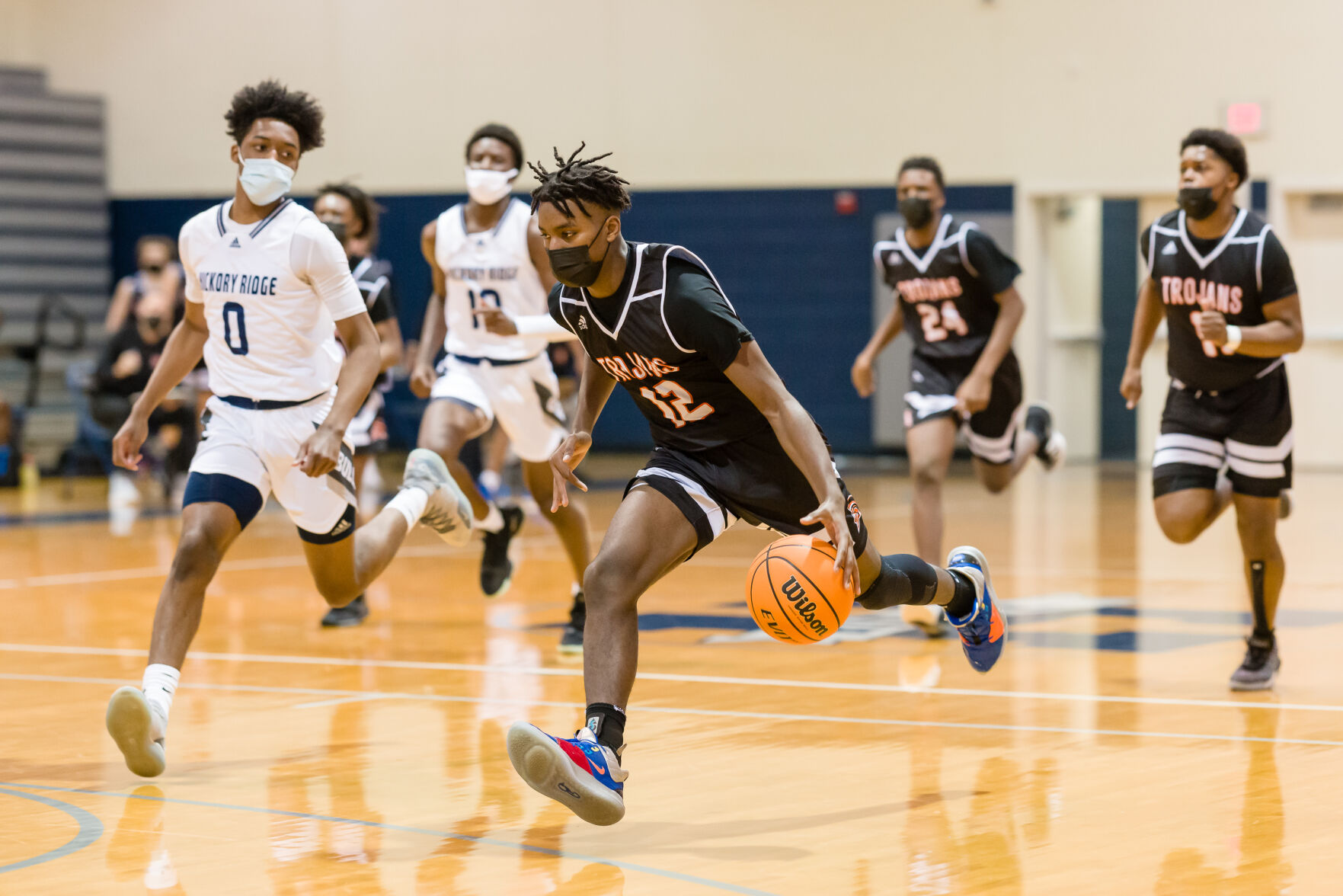 Boys Basketball: Hickory Ridge RaginÕ Bulls defeated the Northwest Cabarrus Trojans 64-56.